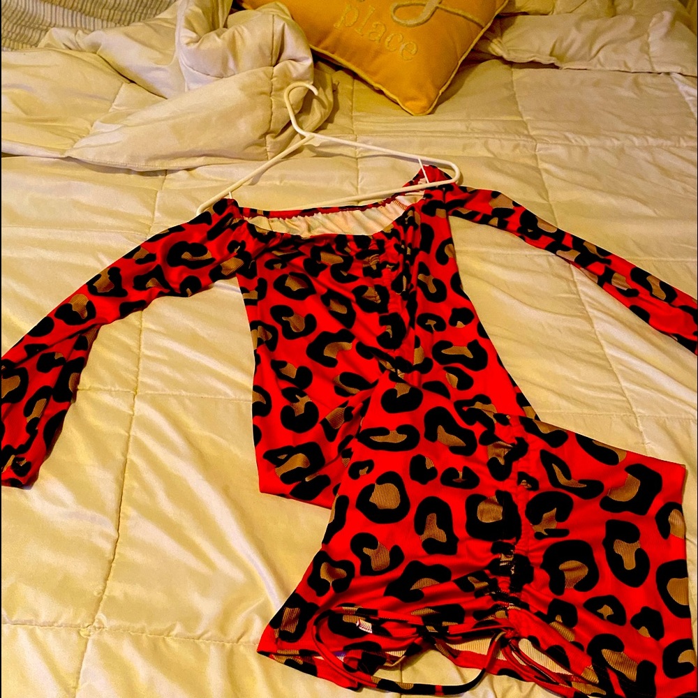 Stretchy red with leopard prints, goes past knees